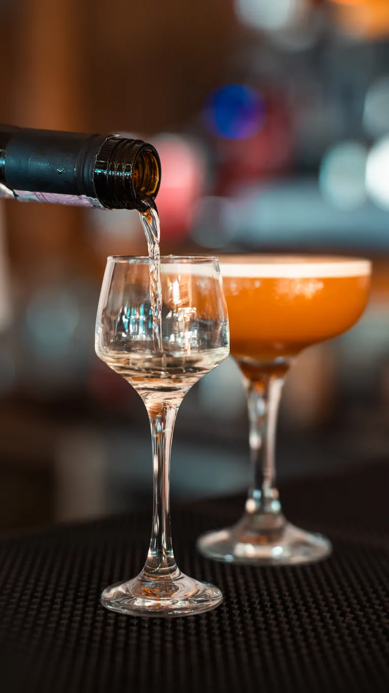 Drink being poured into a glass