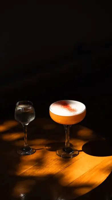 Two cocktails on a wooden table